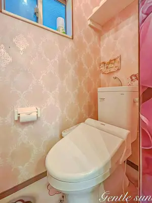 a pink bathroom with a toilet and a sink at princess castle JR Takadanobaba 5 mins Shinjuku area in Tokyo