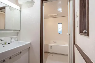 a white bathroom with a sink and a bath tub at princess castle JR Takadanobaba 5 mins Shinjuku area in Tokyo