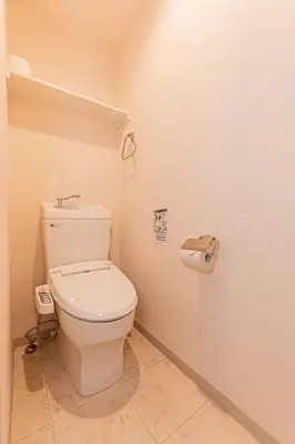 a bathroom with a white toilet in a room at Mi-Hotel Ikebukuro in Tokyo