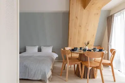 a bedroom with a bed and a table and chairs at House Hotel Shin Ekoda401 DE41 in Tokyo