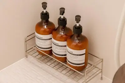 three bottles of honey sitting on a rack in a refrigerator at House Hotel Shin Ekoda401 DE41 in Tokyo