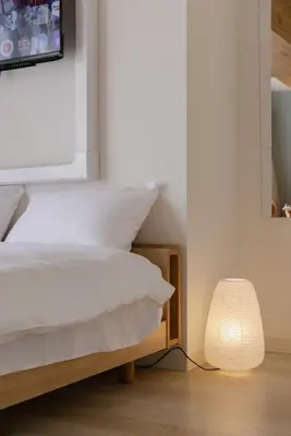 a bedroom with a bed and a lamp at House Hotel Shin Ekoda401 DE41 in Tokyo