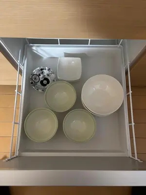 a drawer with four plates and a vase in it at Quiet and beautiful house nearby Tokyo Skytree in Tokyo