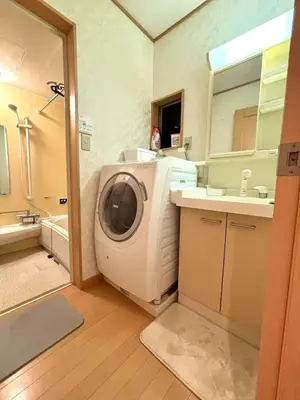 a washing machine in a bathroom with a sink at Quiet and beautiful house nearby Tokyo Skytree in Tokyo