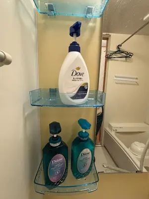 two bottles of detergent on a shelf in a bathroom at Quiet and beautiful house nearby Tokyo Skytree in Tokyo