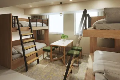 a small room with bunk beds and a table at WAYPOINT TSUKIJI Tokyo in Tokyo
