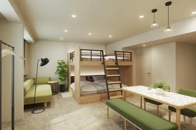 a room with two bunk beds and a table at WAYPOINT TSUKIJI Tokyo in Tokyo