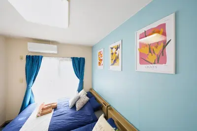 a bedroom with a bed and a window at Shamrock Aoto 304 Cozy Tokyo Stay Near Station Airport Disney Access in Tokyo