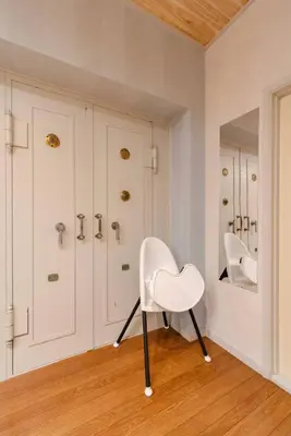 a white chair in a room with a mirror at Maison Shin Nakano 101 MS11 in Tokyo
