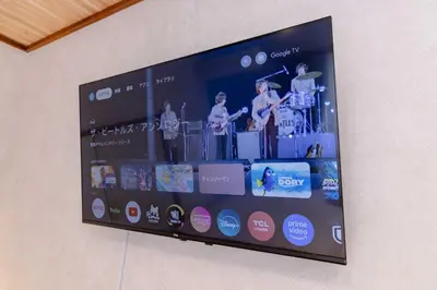 a large display screen on a wall at Maison Shin Nakano 101 MS11 in Tokyo