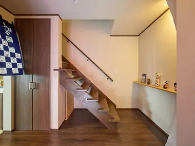a hallway with a staircase in a house at Yadoya Asakusa Kokeshian in Tokyo