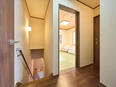 a hallway with a door leading to a bedroom at Yadoya Asakusa Kokeshian in Tokyo