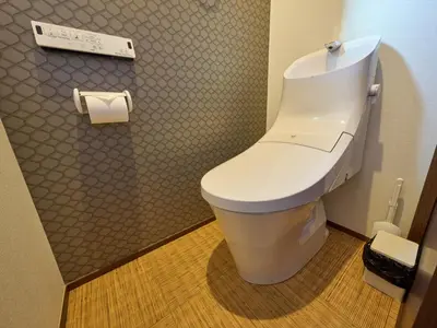 a bathroom with a white toilet in a room at Yadoya Asakusa Kokeshian in Tokyo