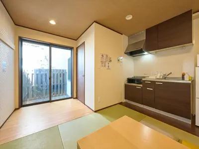 a kitchen with a large window and a view of a city at Yadoya Asakusa Kokeshian in Tokyo