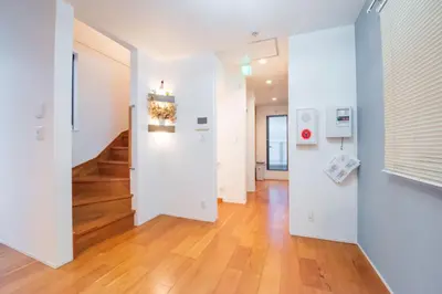an empty hallway with white walls and wood floors at Hatagaya Honmachi house \u6da9\u8c37-SY0488 in Tokyo