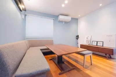 a living room with a couch and a table at Hatagaya Honmachi house \u6da9\u8c37-SY0488 in Tokyo