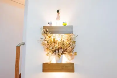 a shelf with a flower arrangement on a wall at Hatagaya Honmachi house \u6da9\u8c37-SY0488 in Tokyo