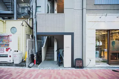 a building with a bike parked inside of it at Svalley YIG stay 401 in Tokyo