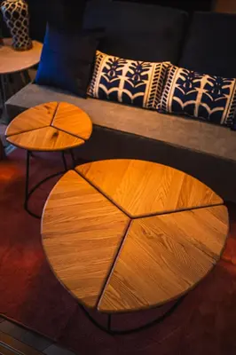 a wooden table in a living room with a couch at Svalley YIG stay 401 in Tokyo