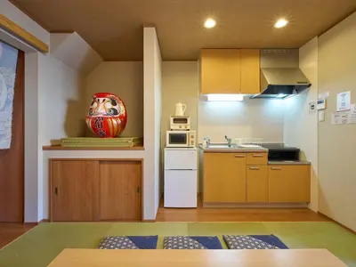 a small kitchen with a sink and a microwave at Yadoya Asakusa Darumaan in Tokyo