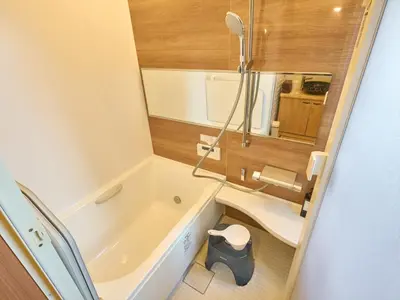 a small bathroom with a tub and a sink at Yadoya Asakusa Darumaan in Tokyo