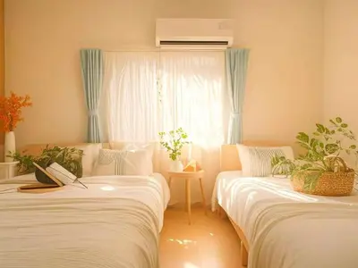 two beds in a room with a window at Grace Tokyo Yazen located at Ikebukuro Station Direct access to Shinjuku and Shibuya Comfortable and convenient for travel in Tokyo