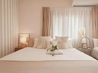 a white bedroom with a large white bed and a window at Grace Tokyo Yazen located at Ikebukuro Station Direct access to Shinjuku and Shibuya Comfortable and convenient for travel in Tokyo