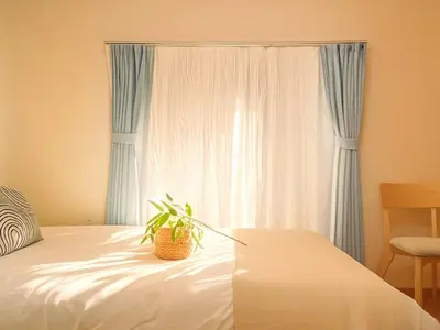 a bedroom with a bed with a potted plant on it at Grace Tokyo Yazen located at Ikebukuro Station Direct access to Shinjuku and Shibuya Comfortable and convenient for travel in Tokyo