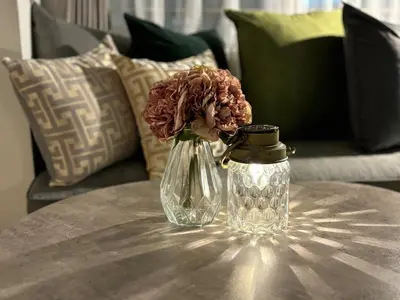 a glass vase with a flower in it on a table at Kagisippo yushima in Tokyo