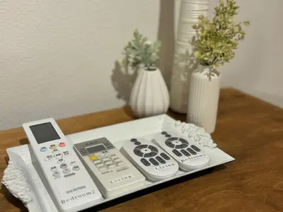 three remote controls sitting on top of a table at Kagisippo yushima in Tokyo