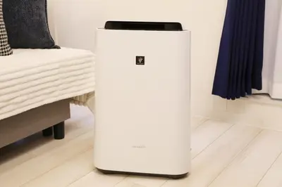 a white refrigerator in a room next to a bed at Espada KAMEARI 103 in Tokyo