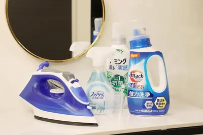 a bathroom counter with a bottle of cleaner and a mirror at Espada KAMEARI 103 in Tokyo
