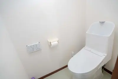 a bathroom with a white toilet and a toilet paper dispenser at 203 Room, a 6-minute walk from Tokyo Koiwa Station Direct connected to Shinjuku and Akihabara Stations Comfortable one-bedroom apartment with separate wet and dry areas in Tokyo