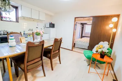 a kitchen and dining room with a table and chairs at 203 Room, a 6-minute walk from Tokyo Koiwa Station Direct connected to Shinjuku and Akihabara Stations Comfortable one-bedroom apartment with separate wet and dry areas in Tokyo