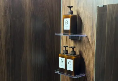 two bottles of soap on shelves on a wall at Js Asakusa 6-minute walk from Asakusa Station in Tokyo