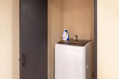 a bathroom with a sink on top of a refrigerator at Js Asakusa 6-minute walk from Asakusa Station in Tokyo