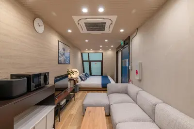 a living room with a couch and a bed at Js Asakusa 6-minute walk from Asakusa Station in Tokyo