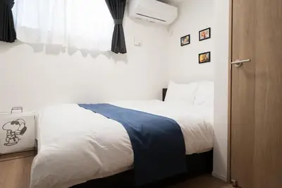 a bedroom with a white bed and a window at 3BRBig House for 7 2 Stops Direct to Tokyo Skytree EntireHome in Sumida in Tokyo