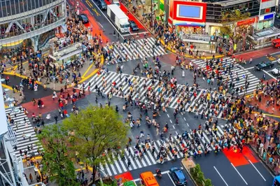 a crowd of people crossing a street in a city at 3BRBig House for 7 2 Stops Direct to Tokyo Skytree EntireHome in Sumida in Tokyo