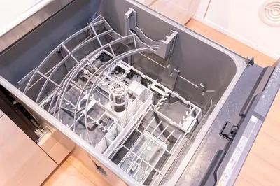 an open dishwasher with a dish rack in it at Deload Hotel \u6771\u4eac\u3059\u307f\u3060 in Tokyo