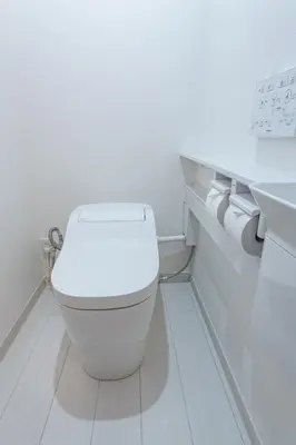 a white bathroom with a toilet and two rolls of toilet paper at VicoloHouse\u5343\u4f4f\u5927\u6a4b,Family Friendly New House,Near Skytree,12 Guests in Tokyo