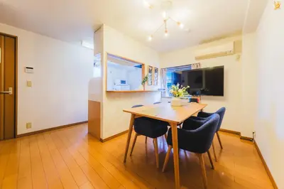 a kitchen and dining room with a table and chairs at KR Fit Stay Kami-Itabashi in Tokyo