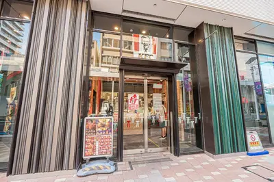 a store front with the door open on a city street at Minami Inn 3 bed rooms Villa 8 minutes walk from JR line Koiwa station For Family in Tokyo