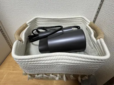 a black object in a white basket on the floor at 15 min to Shinjuku, 4 min walk to nearest station, quiet brand-new residence in Tokyo