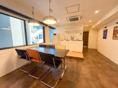 a kitchen and dining room with a table and chairs at 52 House Nishi-Shimbashi in Tokyo