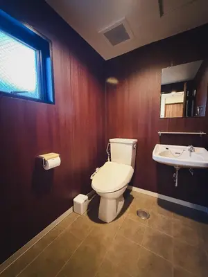 a bathroom with a toilet and a sink at 52 House Nishi-Shimbashi in Tokyo