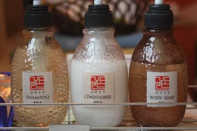 three bottles of milk are sitting on a shelf at Hotel Bianca Due (Adult Only) in Tokyo