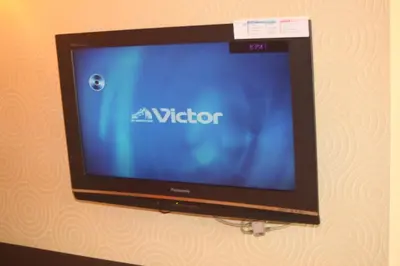 a flat screen tv hanging on a wall at Hotel Bianca Due (Adult Only) in Tokyo