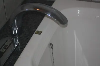 a silver faucet on a white bath tub at Hotel Bianca Due (Adult Only) in Tokyo