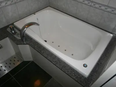 a white bath tub with a faucet in a bathroom at Hotel Bianca Due (Adult Only) in Tokyo